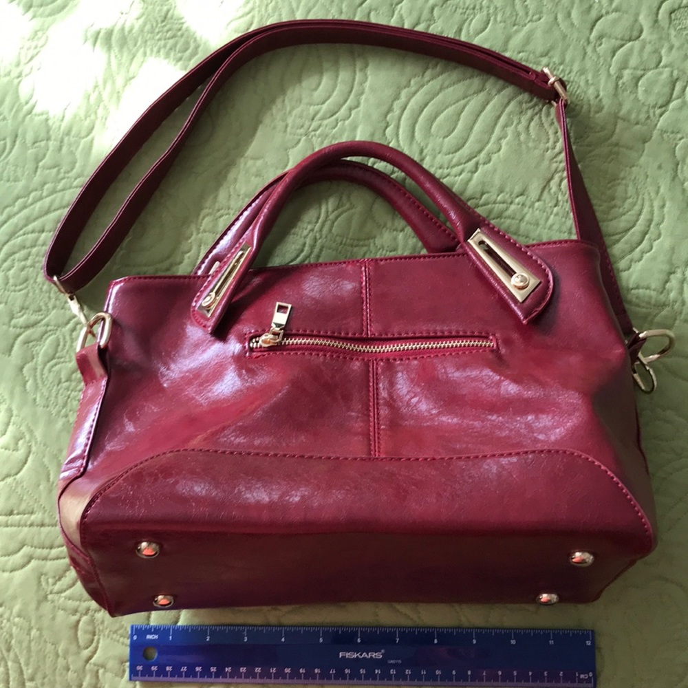 Red leather handbag.